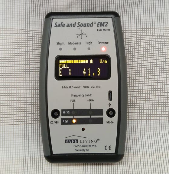 Safe and Sound EM2 EMF Meter measuring high AC electric field on bed